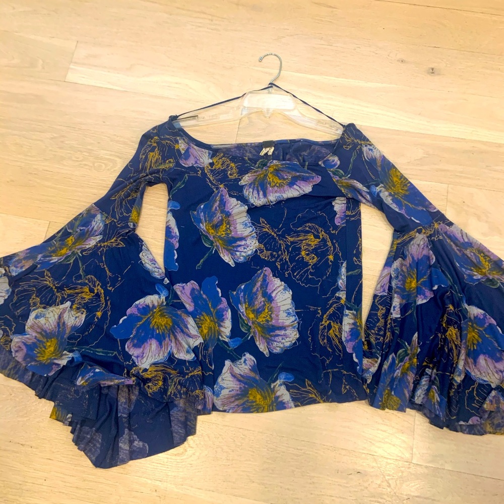 We the free by free people. Royal blue off the shoulder top with floral print